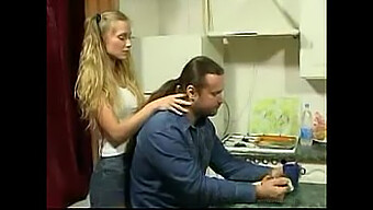 A Mature Man Is Enticed In A Kitchen Setting